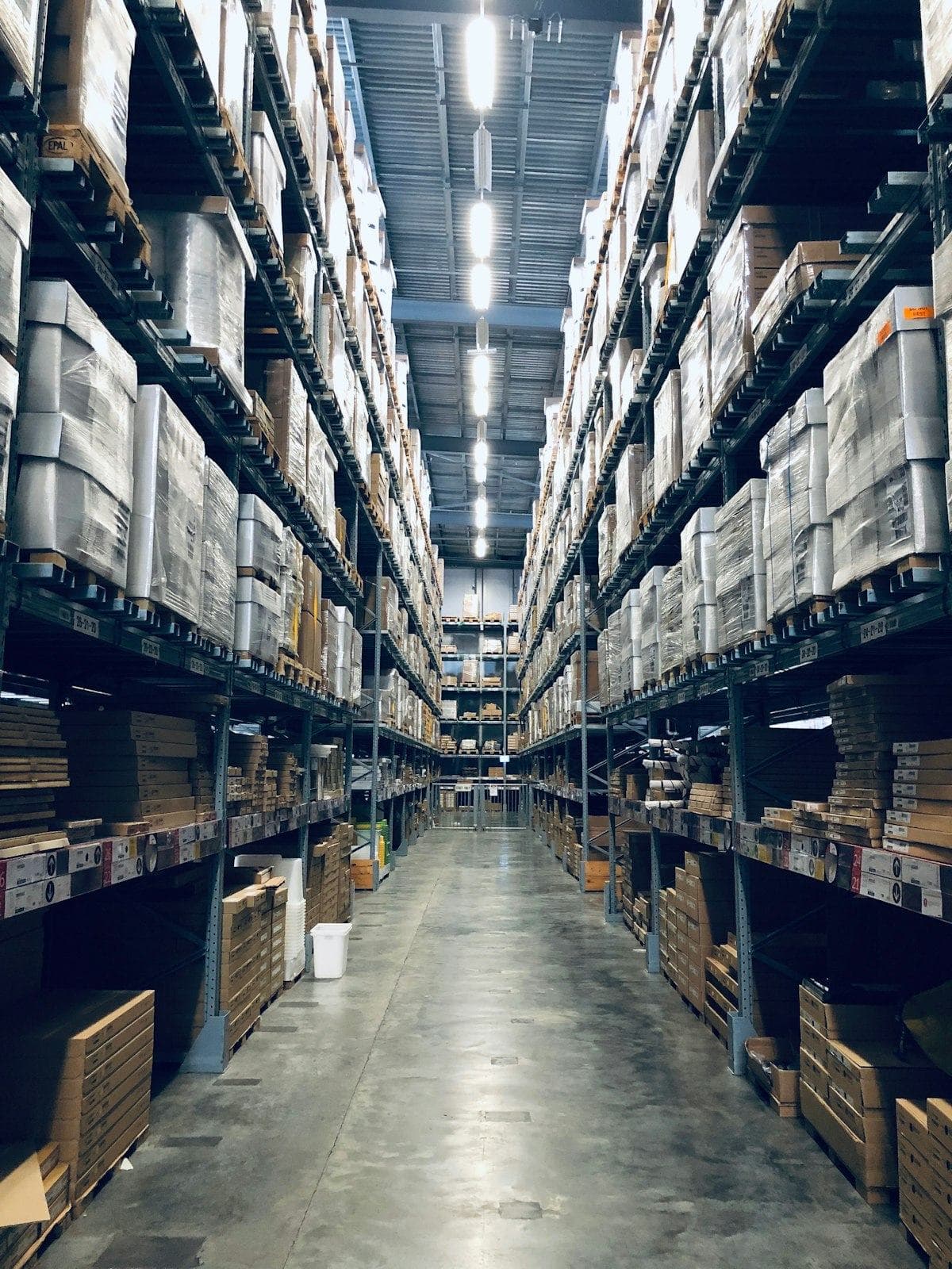 Warehouse aisle stacked with palletised goods